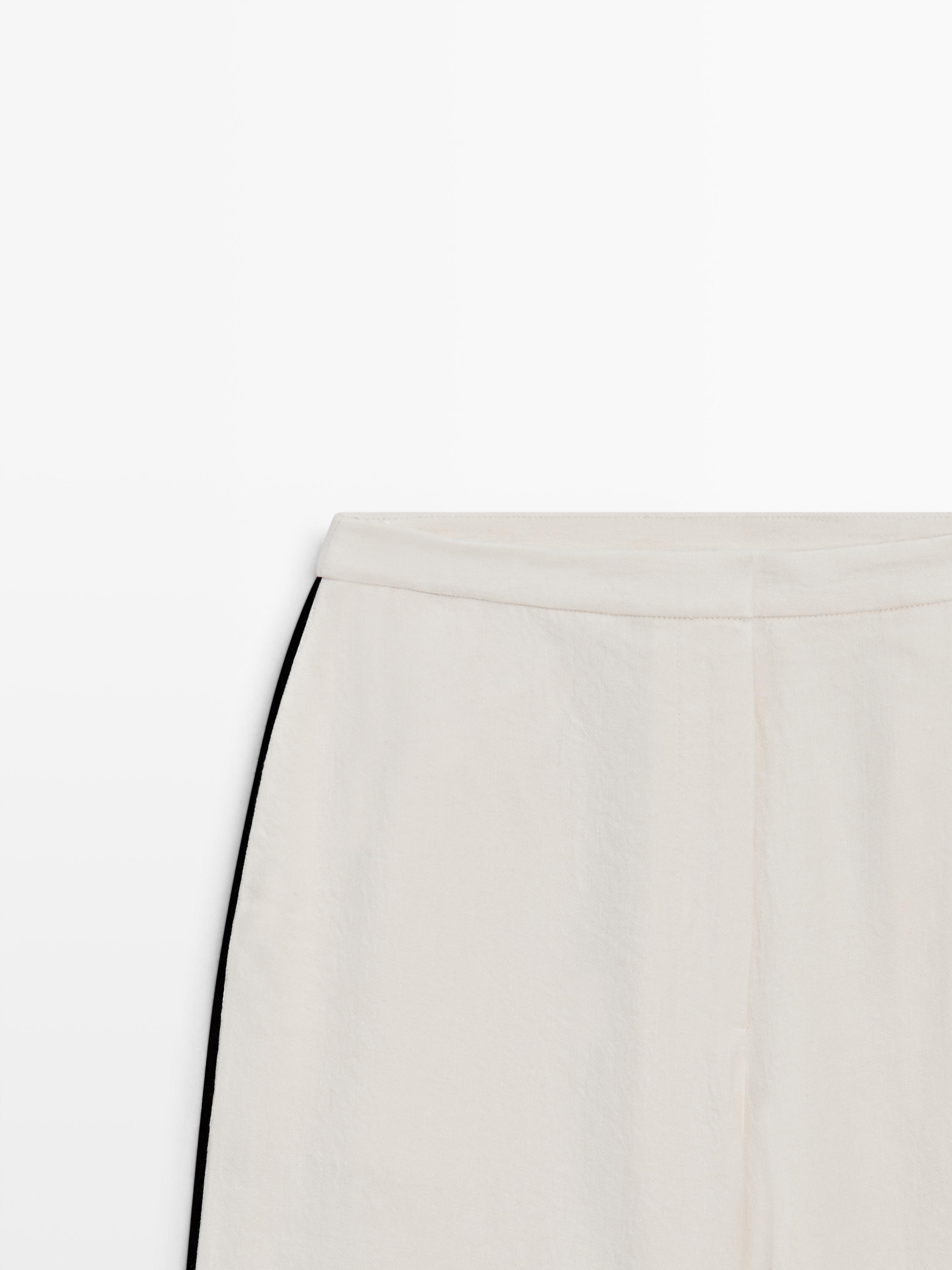 Linen trousers with contrast piping